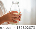 clean child holding milk bottle background design 132802873