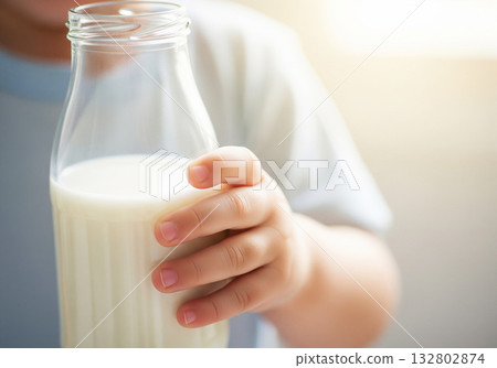 Child holding milk bottle background Child holding milk bottle background 132802874