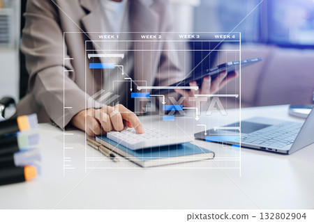 Project manager working and update tasks with milestones progress planning and Gantt chart scheduling diagram. Project manager working and update tasks with milestones progress planning and Gantt chart scheduling diagram. 132802904