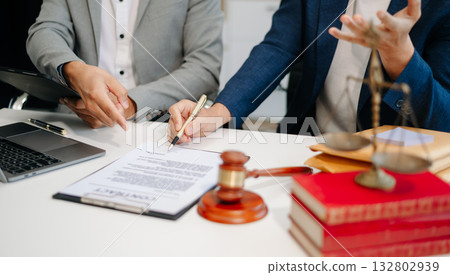 business people and lawyers discussing contract papers sitting at the table. Concepts of law, advice, legal services. 132802939