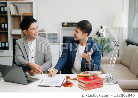 business people and lawyers discussing contract papers sitting at the table. Concepts of law, advice, legal services. business people and lawyers discussing contract papers sitting at the table. Concepts of law, advice, legal services. 132802940