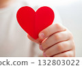 Close up hand holding red heart symbol 132803022