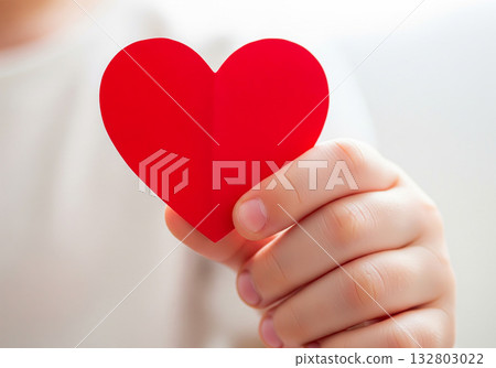 Close up hand holding red heart symbol 132803022
