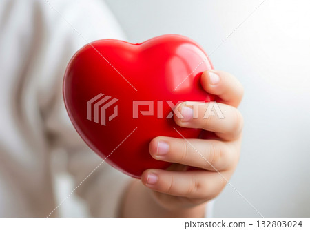 Close up hand holding red heart shape Close up hand holding red heart shape 132803024