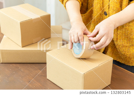 Packing cardboard boxes Packing cardboard boxes 132803145