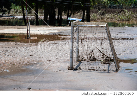 Soccer goal having damaged and mud flooded after Kok river rising and flooding Chiang Rai province, Thailand. 132803160
