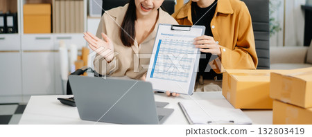 Starting small businesses SME owners, two check online orders Selling products working with boxs freelance work at home office marketing concept Starting small businesses SME owners, two check online orders Selling products working with boxs freelance work at home office marketing concept 132803419