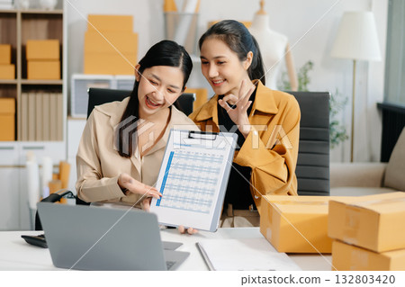Starting small businesses SME owners, two check online orders Selling products working with boxs freelance work at home office marketing concept Starting small businesses SME owners, two check online orders Selling products working with boxs freelance work at home office marketing concept 132803420