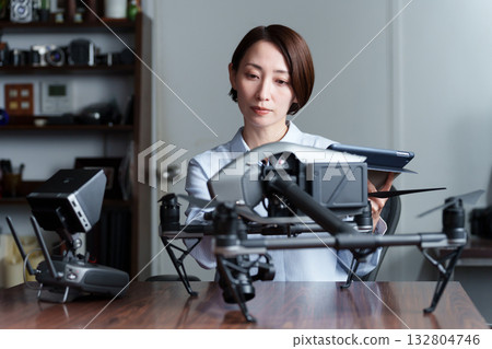 Female developer researching drones Female developer researching drones 132804746