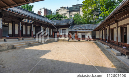 Traditional Korean wooden buildings with tiled roofs form a courtyard at Unhyeongung Palace, a former royal residence showcasing the architecture of the Joseon dynasty in the heart of Seoul Traditional Korean wooden buildings with tiled roofs form a courtyard at Unhyeongung Palace, a former royal residence showcasing the architecture of the Joseon dynasty in the heart of Seoul 132805608