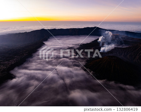 Aerial view Mountains at Bromo volcano during sunrise sky,Beautiful Mountains Penanjakan in Bromo Tengger Semeru National Park,East Java,Indonesia.Nature landscape background Aerial view Mountains at Bromo volcano during sunrise sky,Beautiful Mountains Penanjakan in Bromo Tengger Semeru National Park,East Java,Indonesia.Nature landscape background 132806419