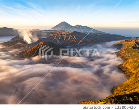 Aerial view Mountains at Bromo volcano during sunrise sky,Beautiful Mountains Penanjakan in Bromo Tengger Semeru National Park,East Java,Indonesia.Nature landscape background Aerial view Mountains at Bromo volcano during sunrise sky,Beautiful Mountains Penanjakan in Bromo Tengger Semeru National Park,East Java,Indonesia.Nature landscape background 132806420