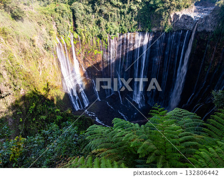 Aerial view of the Tumpak Sewu Waterfalls also known as Coban Sewu.Beautiful Tumpak Sewu Waterfalls are a tourist attraction in East Java, Indonesia.Amazing travel destination in asia 132806442