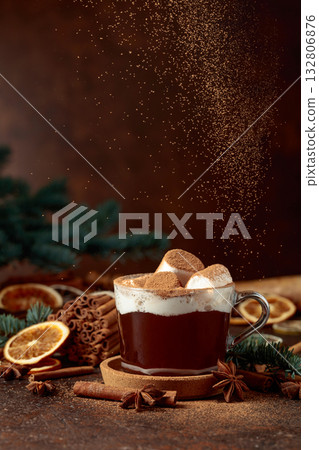 Hot chocolate with marshmallows sprinkled with cocoa powder. 132806876