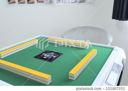 A table lined with mahjong tiles 132807352