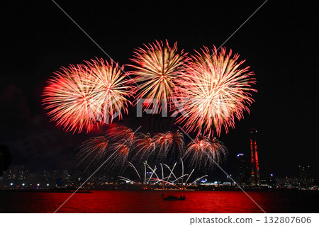 Colorful fireworks at night over the river. Colorful fireworks at night over the river. 132807606
