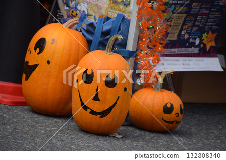 Halloween pumpkins (jack-o'-lanterns) displayed on the street at a Halloween event in the city 132808340