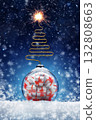 New Year's card with a ball and gifts inside in the form of a bomb on the snow, a Christmas tree wick and sparks. Festive banner with hoarfrost on night abstract defocused lights background. 132808663