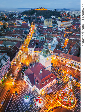 Brasov, Romania. Christmas Market, twilight beautiful lights, aerial drone view with Main Square, Transylvania holiday destination. 132808746