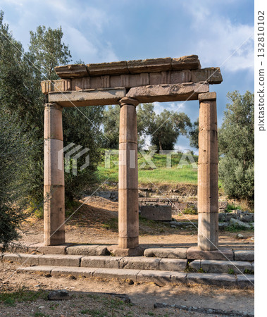 Asclepieion of Pergamon ancient columns, olive trees, and blue sky, Bergama, Turkey. Asclepieion of Pergamon ancient columns, olive trees, and blue sky, Bergama, Turkey. 132810102