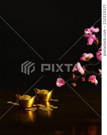 Golden ingots and cherry blossoms for Chinese New Year Golden ingots and cherry blossoms for Chinese New Year 132810325