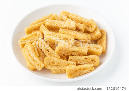 Deep-fried tofu (deep-fried tofu) on a plate on a white background 132810474