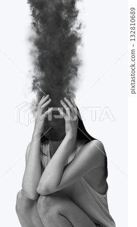 Surreal collage art. Woman sitting with smoke replacing head symbolizing anxiety overload 132810689
