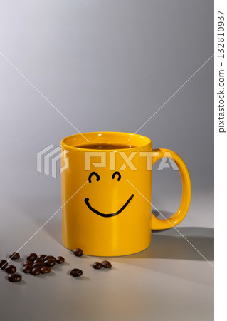 Bright Yellow Mug With a Smiley Face Brings Joy to Your Morning Coffee Routine Bright Yellow Mug With a Smiley Face Brings Joy to Your Morning Coffee Routine 132810937