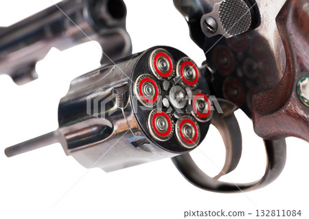 Closeup of revolver with open fully loaded cylinder Closeup of revolver with open fully loaded cylinder 132811084