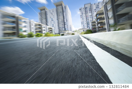 Urban road speeding through modern city buildings 132811484