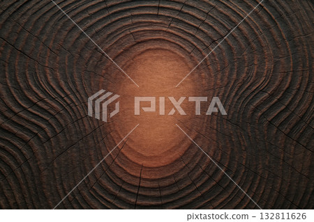 Wooden surface displaying intricate patterns and textures from years of natural growth and aging in a close-up view Wooden surface displaying intricate patterns and textures from years of natural growth and aging in a close-up view 132811626