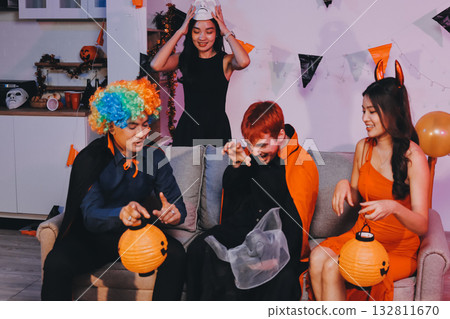 Joyful office Halloween party with coworkers in costumes, celebrating with drinks and laughter, fostering teamwork and festive spirit 132811670