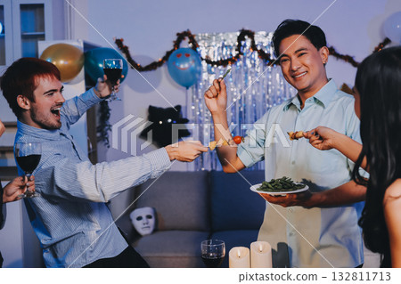 Diversity, dinner and group of people toast celebration together at party. Friends, happy and celebrate with food, wine and friendship for love, support and cheers champagne at business function Diversity, dinner and group of people toast celebration together at party. Friends, happy and celebrate with food, wine and friendship for love, support and cheers champagne at business function 132811713