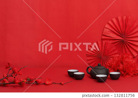Minimalist Background with Teapot and Red Decorations for Lunar New Year 132811756