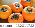 Close-up of Aizu Mineshirasu persimmons on a wooden table Close-up of Aizu Mineshirasu persimmons on a wooden table 132811782