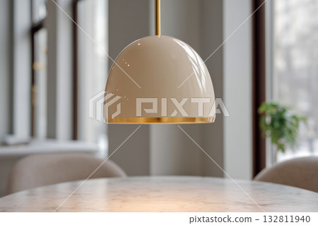 Modern dome shaped pendant lamp hanging above marble table Modern dome shaped pendant lamp hanging above marble table 132811940