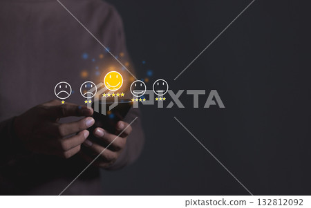 Happy Customer, Young Man hand holding Smart Phone with five star to review and give 5 stars  132812092