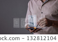 Young man with smartphone mobile hand using a pen touching to sign a Online Business Contract 132812104