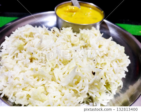 Traditional Indian Kadhi with Steamed Rice Served in Steel Plate Traditional Indian Kadhi with Steamed Rice Served in Steel Plate 132813400