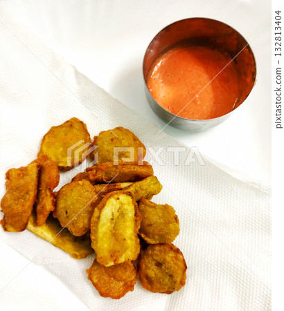 Banana Fritters Served with Spicy Red Chutney 132813404