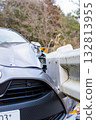 A passenger car that collided with a guardrail and sustained damage to the left front 132813955