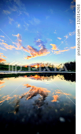 A breathtaking sunset scene created by the sky and the water 132814268
