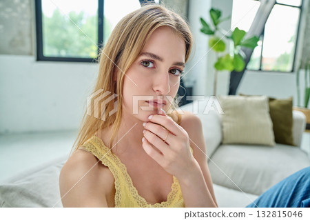 Close-up selfie portrait of serious teenage female looking at web camera Close-up selfie portrait of serious teenage female looking at web camera 132815046