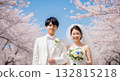 A wedding couple blessed by the spring breeze and cherry blossoms A wedding couple blessed by the spring breeze and cherry blossoms 132815218