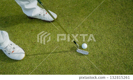 Golfers are putting golf in the evening golf course golf backglound. 132815261