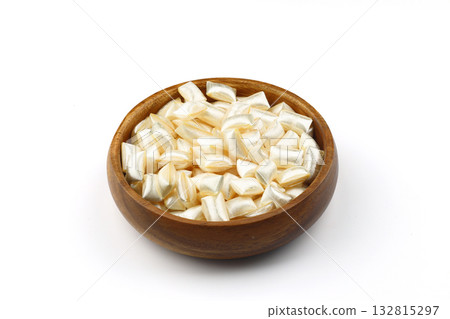 White sugar in a wooden bowl on a white background. Ramadan Feast candy. 132815297