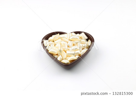 White sugar in a wooden bowl on a white background. Ramadan Feast candy. 132815300
