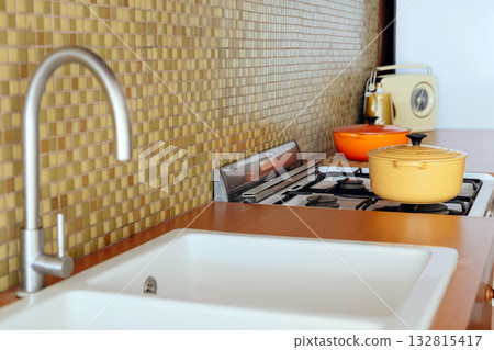 Modern kitchen interior with gas stove and utensils Modern kitchen interior with gas stove and utensils 132815417