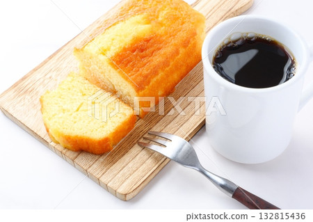 Pound Cake and Coffee - Enjoy a light snack of fluffy pound cake and freshly brewed coffee. 132815436