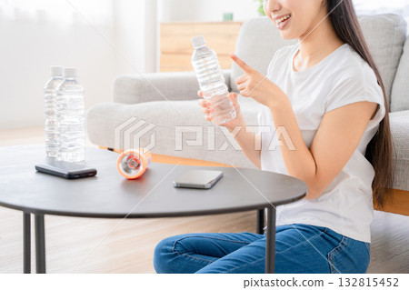 A young woman checking disaster prevention supplies A young woman checking disaster prevention supplies 132815452